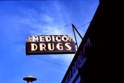 Medico Drugs sign located on the east side of North Main Street in Sebastopol, California, 1977