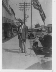 George Pease in front of his drug store on the corner of North Main Street and Bodega Avenue, Sebastopol, about 1919