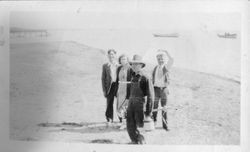 Unidentified group of four adults on the beach at Bodega Bay, about 1920