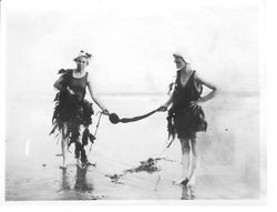 Two women dressed in vintage bathing suits and wrapped in sea kelp, 1920s