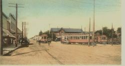 View looking north on Sebastopol's Main Street with three train cars of the Petaluma & Santa Rosa Railroad (P&SR) visible