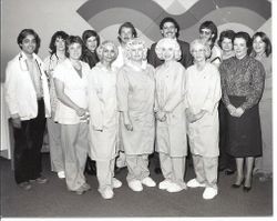 Unidentified woman cutting cake at the Palm Drive Hospital Three year service awards, 1984