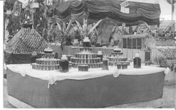 1911 Gravenstein Apple Show display with jars and glasses containing perhaps apple juice or cider