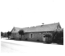 North gable end and west facade of the Petaluma & Santa Rosa Railway Powerhouse built 1903 from Stony Point Quarry rock, June 15, 1990