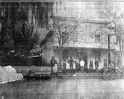 Group of men standing in front of the Montreal Saloon in Occidental prior to 1904