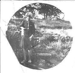 Alma May Smith in her grandmother's garden, age 10, about 1913