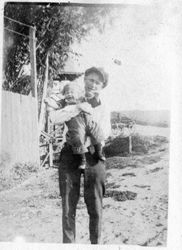 Karl Asman holding his niece Harriet Elvy near the Bodega Bay store, 1918