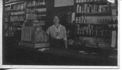 Unidentified woman in a general store or mercantile, possibly, about 1915