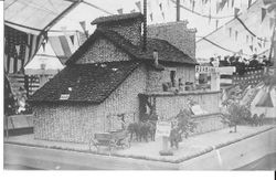 1910 Gravenstein Apple Show display of the Pleasant Hill fruit evaporator (dryer) made of whole and dried apples as seen from a different angle