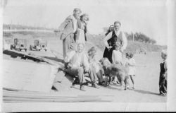 Unidentified group of men, women and children pose at the Bodega Bay beach, about 1920