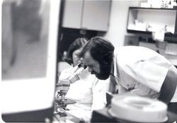 Marvin Fuller, X-ray tech at microscope and Charlene Rundstrom lab, Palm Drive Hospital, 1978