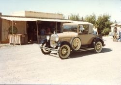 Vintage cars visit the Hallberg Apple Farm roadside stand, October, 1982