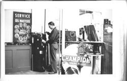 Delbert Triggs working in the machine shop at J. F. Triggs & Son Auto parts store, 130 South Main Street Sebastopol, 1939