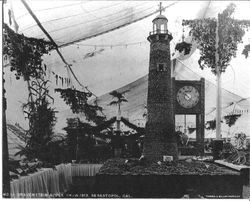 Gravenstein Apple Show displays in 1913 of a lighthouse sponsored by the Jonive District, a dirigible and a Stony Point sign