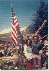 Darrel Hurst in front of an apple sculpture with the Enmanji Buddhist Temple in the rear in Sebastopol, 1973