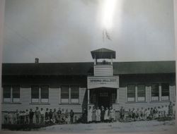 Students and teachers lined up on either side of the front entrance of Spring Hill School on Spring Hill School Road, Sebastopol, about 1914