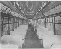 Interior of a P&SR railroad passenger car with unidentified man