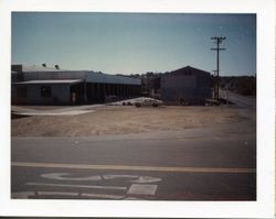 View of the O. A. Hallberg & Sons Apple Products cannery receiving area and cold storage from Graton Road and Bowen Avenue, Graton, California, 1960s