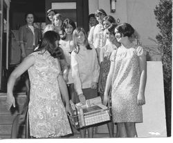 Group of Analy high school girls leaving the Sebastopol Carnegie Library with a basket of books