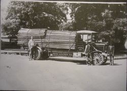 Hess Lumber Co. truck loaded and tied down with lumber in front of the Hess lumber yard in Sebastopol, 1920s