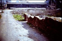 Road and stone foundation of the building that stood at 242 Petaluma Boulevard North at Martha Street, Petaluma, California, 1975