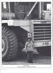 Pomo basket maker Mabel McKay stands in front of a huge truck