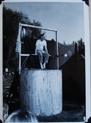 Jack Fore seated above the Sebastopol Lions Club Dunk Tank, Apple Blossom Day, about 1955 (Sebastopol Lions Club scrapbook photo)