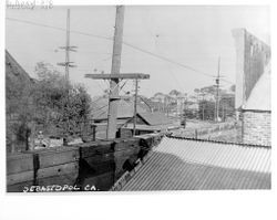 View of the P&SR railway over rooftops, looking west on Main Street, Sebastopol, about 1920