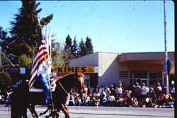 Color guard on horseback in the Apple Blossom Parade on North Main Street near McKinley Street, Sebastopol, California, 1970s