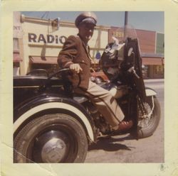 Sebastopol Police Officer Lemual "Shorty" Plumley on his police motorcycle on Sebastopol's Main Street, April, 1961