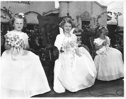 Sebastopol Apple Blossom Princesses Peggy Osborn (Stevens), Kathleen Fleming and Helen Inman in front of Chamber of Commerce building, about 1951