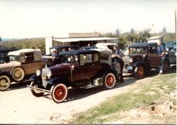 Vintage cars visit the Hallberg Apple Farm roadside stand, October, 1982