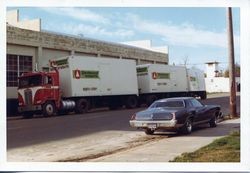 Semi-trailer truck parked at side of cannery on Bowen Street at O. A. Hallberg & Sons Apple Products cannery in Graton, California