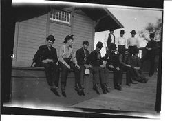 Railroad workers on train station platform in Forestville