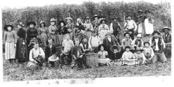 Group photo of about 30 men, women and children field workers at the Thomas Miller hop ranch in the Hall District, about 1880