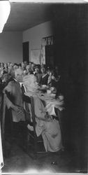 Mr. and Mrs. Chester Myers seated at a long table celebrating their 50th wedding anniversary in 1930