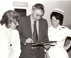 Al Carrion, hospital director with staff members or nurses, about 1970