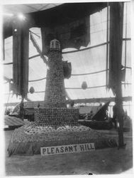 1913 Gravenstein Apple Show display of a lighthouse made of apples sponsored by the Pleasant Hill apple district