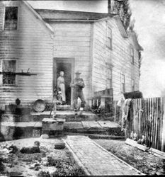 A. J. Peterson home in Santa Rosa, with Mrs. Ludencia Peterson in doorway, about 1908