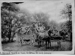 Large group of child berry pickers from the Children's Aid Society in San Francisco in a horse drawn wagon going to a nearby farm to pick berries, 1910s