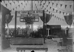 Gravenstein Apple Show exhibit 1911 in Sebastopol, showing various displays and large sign "The Gravenstein Apple from 4001 BC to 1911 AD."