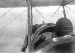 August S. Huck, Sr. in the cockpit of a bi-plane