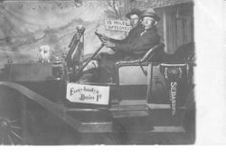 Staged photo of two people in a car at the 1912 Gravenstein Apple Show