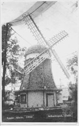 1912 Gravenstein Apple Show display of windmill made of whole and dried apples under large tent