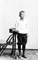 Unidentified young boy in a studio setting