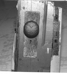 Doorknob and plate from about 1900 Queen Anne cottage at 8008 Covert Lane, Sebastopol, California (demolished 1980), 1993