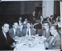 Sebastopol Lions Club members Joe Johnson, Dr. Carl LaForce and other unidentified men around a table, 1952 (Sebastopol Lions Club scrapbook photo)