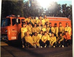 Graton Volunteer Fire Department members stand in front of their fire trunk