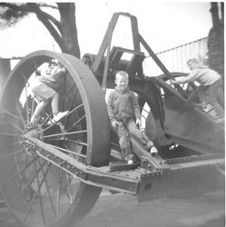 Scott Roberts center with other Roberts children on log puller on Roberts apple ranch Sebastopol, 1970s