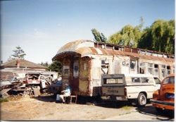 Old P&SR railroad car waiting for restoration on Bloomfield Road in Sebastopol, about 1975